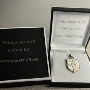 A silver shield with the bible verse philippians 4 : 1 3 in it.