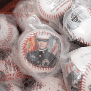 A pile of baseball balls with pictures on them.